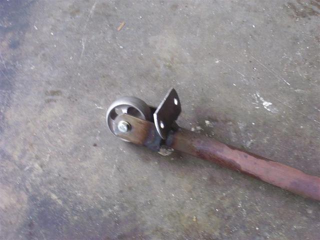 Then I made a poor-man's English Wheel. I made a bracket on the end of a pipe with a  flange to put my foot on.