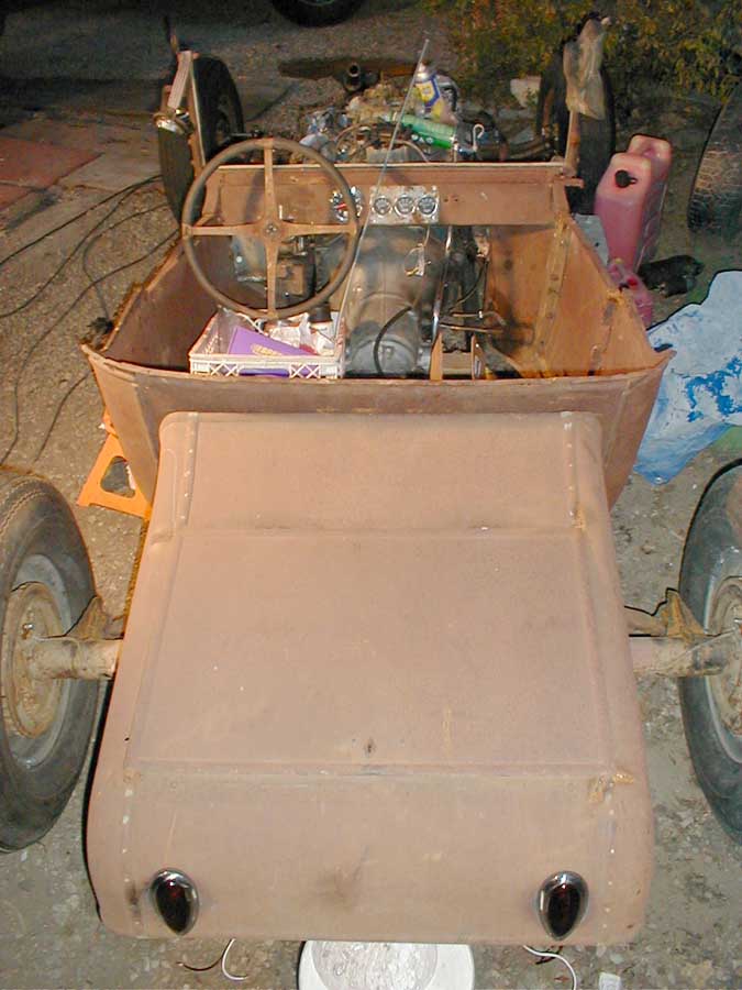 Tail lights in. Tank fit underneath. Steering wheel temporarily mounted.