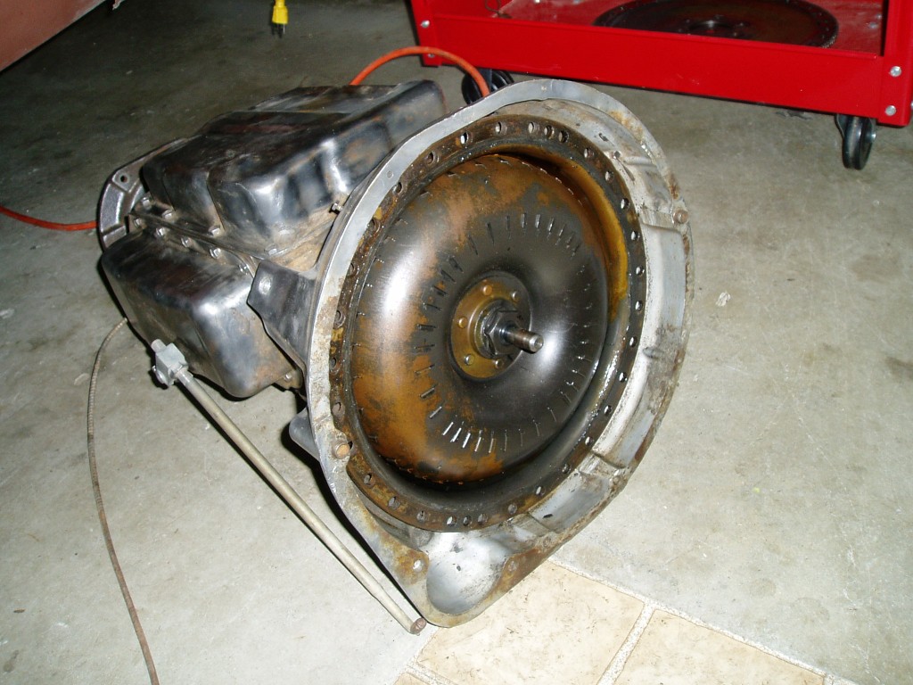 (12/9/05) Someone at the junkyard used a winch to lift it and cracked the aluminum bell housing. Fortunately, the bell housing i