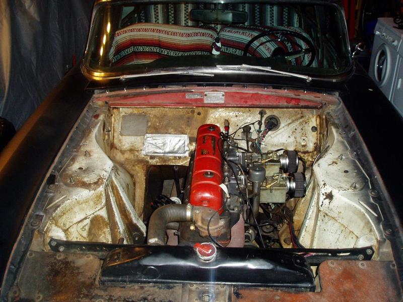 Hood removed. At least it will be easier to work in the engine bay.