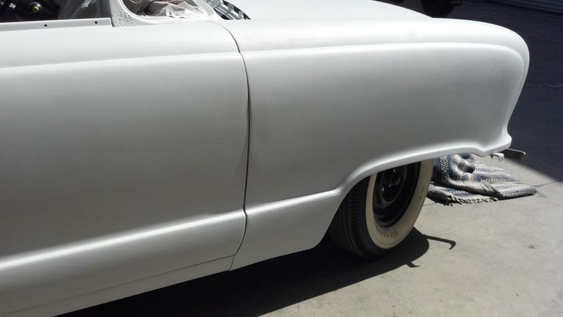 Side-swipe dents removed from fender, door & rocker panels