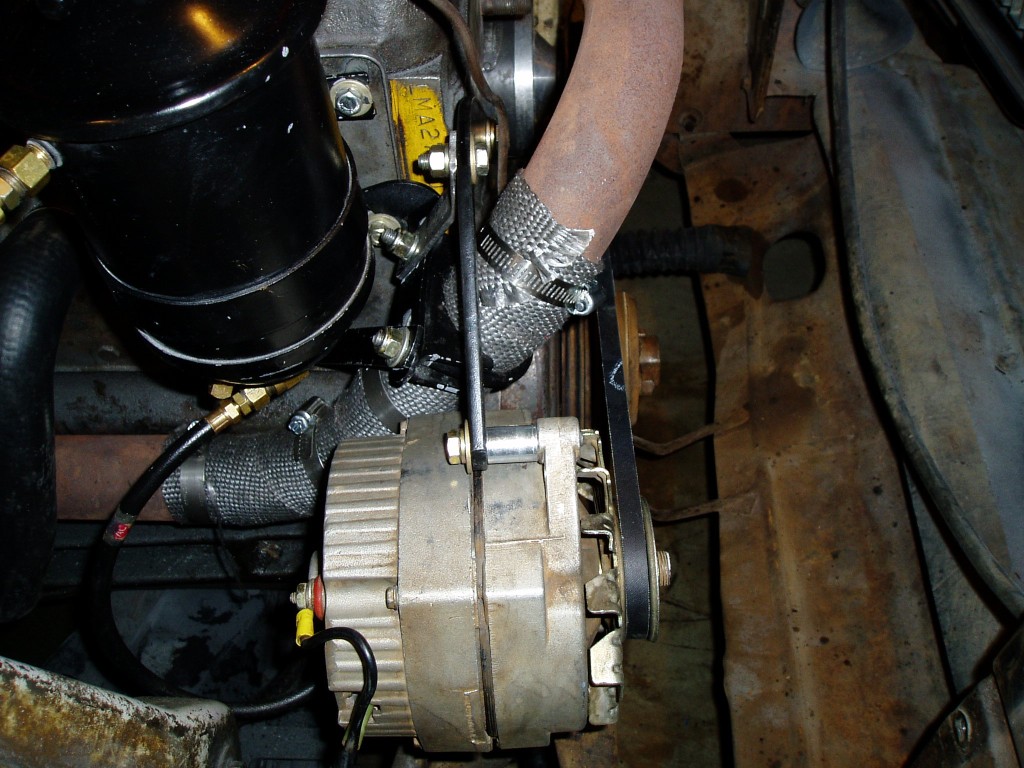 Side view of alternator bracket showing reinforcement at exhaust bracket.