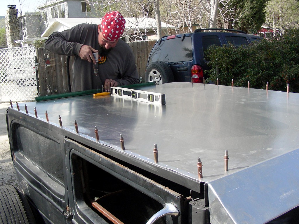 Sheet on, side holes match-drilled. Now starting back holes around curve.