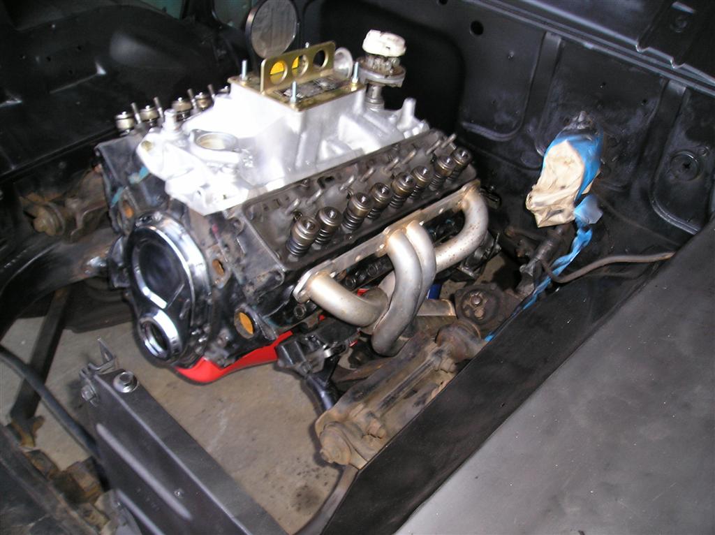 The tube headers will fit with just a little adjustment. 