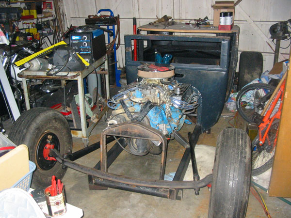 Here's the axle about in the right spot. The rails need to be cut back when I figure out how to attach the front springs. I'll r