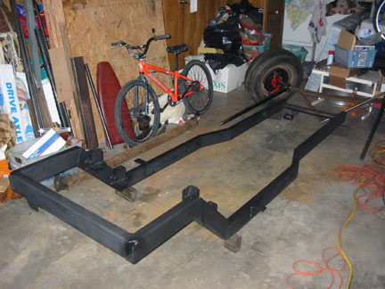 Frame back in garage after some rework. Added some higher 4-link brackets to make up for the change in ride height. Added some b
