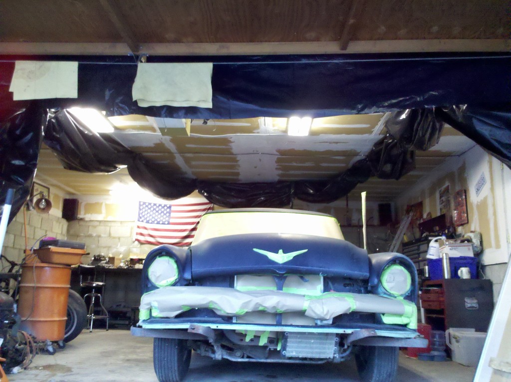 Car stripped of chrome, bumpers, and taped up. Time to do work! 