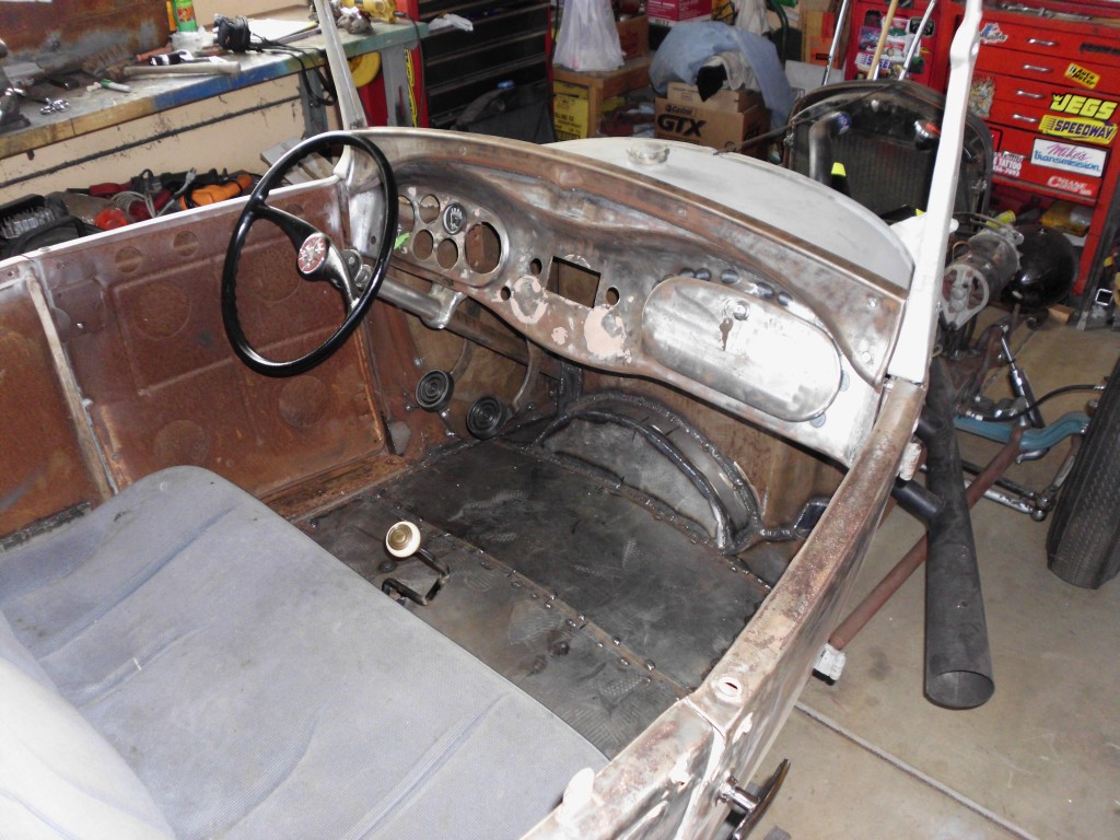 another shot of dash and floor with 50's boat wheel and homemade collumn