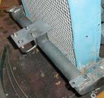 New headlight perches.
This is tough real-estate.
The bigass headlights, steering, radius rods, shocks, radiator shell, and sp