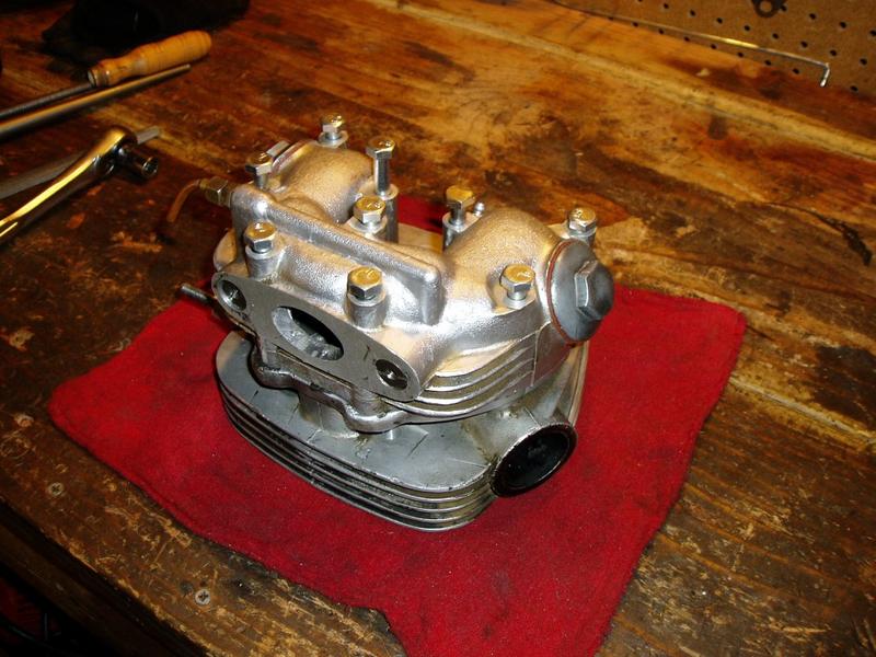 All rocker box studs are replaced by bolts. The holes in the head are all heli-colied. The bolts all thread in easy now, no more