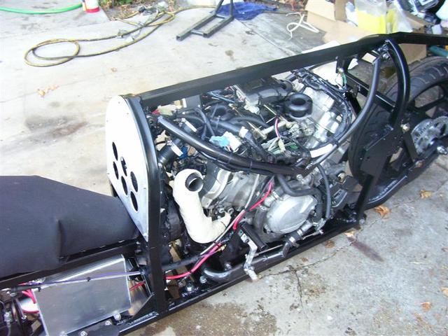 Shows fabbed water return line from the radiator behind the shifter, 