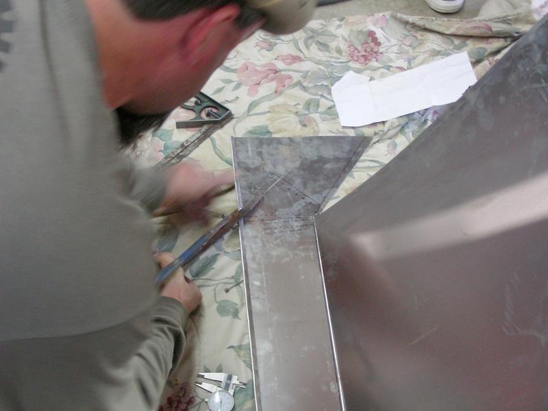 The front edge is folded over, so I can now cut the rest.