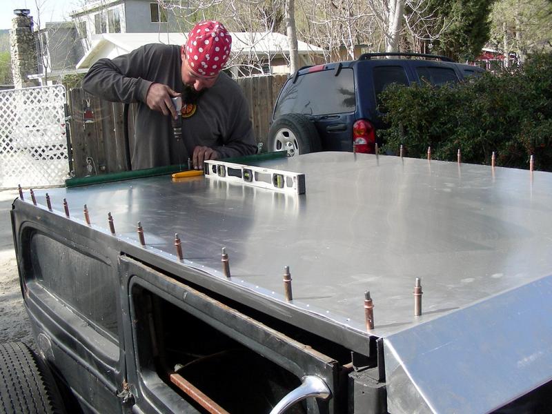 Sheet on, side holes match-drilled. Now starting back holes around curve.