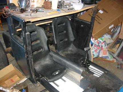 Seats installed, tunnel attached, front wood pieces replaced with alum. 