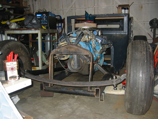 I think the front springs will be mounted on the outside of the frame rails. That'll make them a little wider & easier to ge