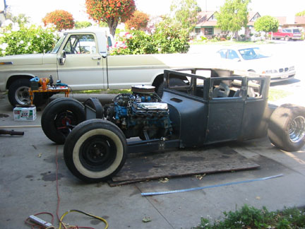 After a six week layoff, back to work. I mounted the radiator & hung the doors. And pushed the beast out of the garage for t