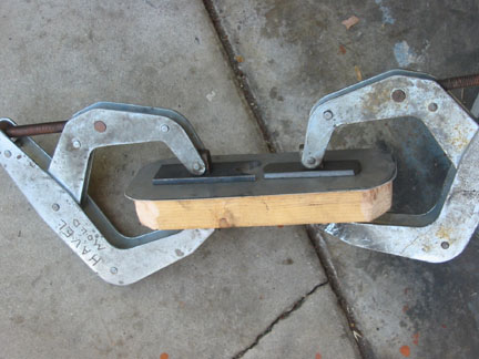 I needed a cover for the vent opening where the throttle linkage goes through. I cut a 2x4 to about the right shape and a piece 