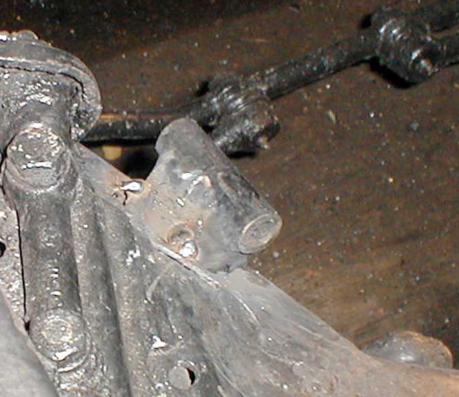 He's recycling the old motor mounts from Jet Fuel's Chrysler.
A window cut for the mount to drop into the crossmember, and this