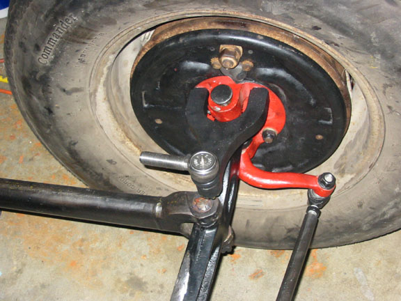 Put on the steering arm & tie rod