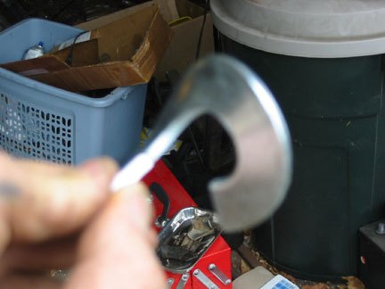 Large (fuzzy) washer cut & bent to auger style baffel.