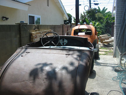 Had to remove an orange tree to get both cars on the side of the house.