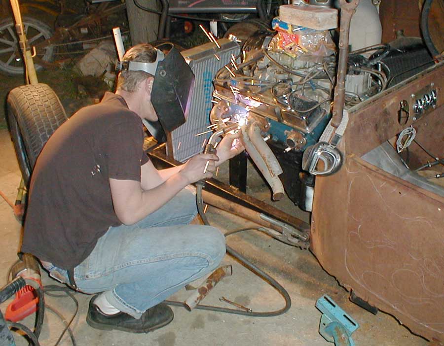 Brian's been getting frustrated 'cause he has so many sets of headers, yet none that work on his car.
Here's his solution.