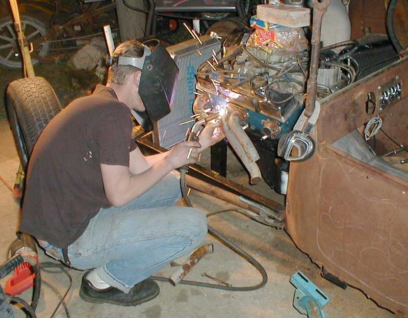 Brian's been getting frustrated 'cause he has so many sets of headers, yet none that work on his car.
Here's his solution.